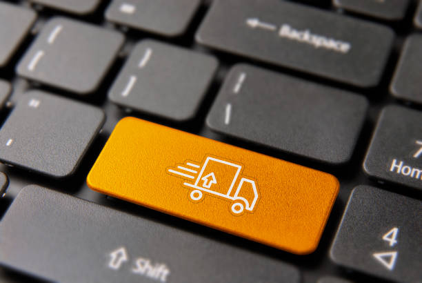 Fast shipping transport service concept: color key button with delivery truck icon on computer keyboard.
